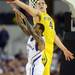 Michigan freshman Mitch McGary attempts to get a hand on the ball as Kansas sophomore Naadir Tharpe passes it to a teammate during the second half at Cowboys Stadium in Arlington, Texas on March 29, 2013. Melanie Maxwell I AnnArbor.com